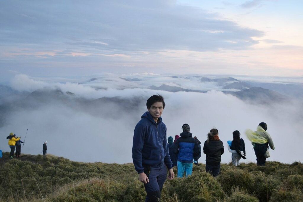 taking pictures at the summit of Mt. Pulag