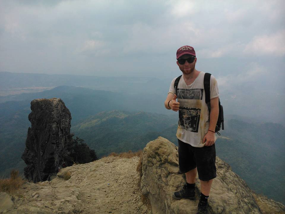 solo picture of American hiker with the view of Monolith