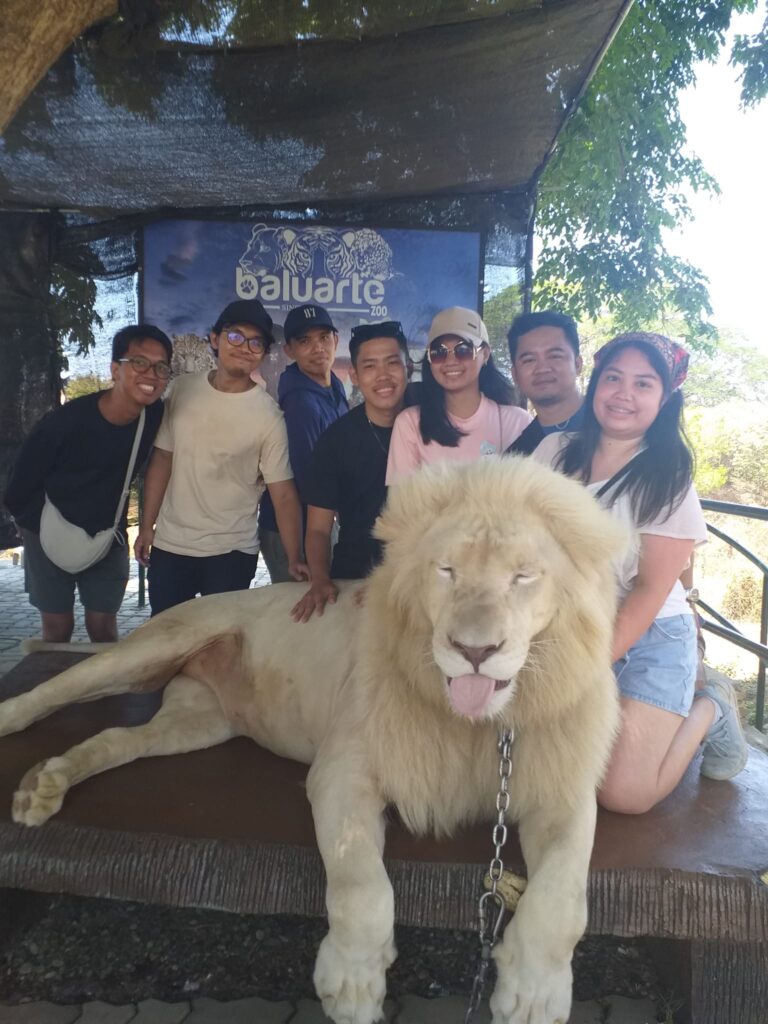group picture with the big white lion