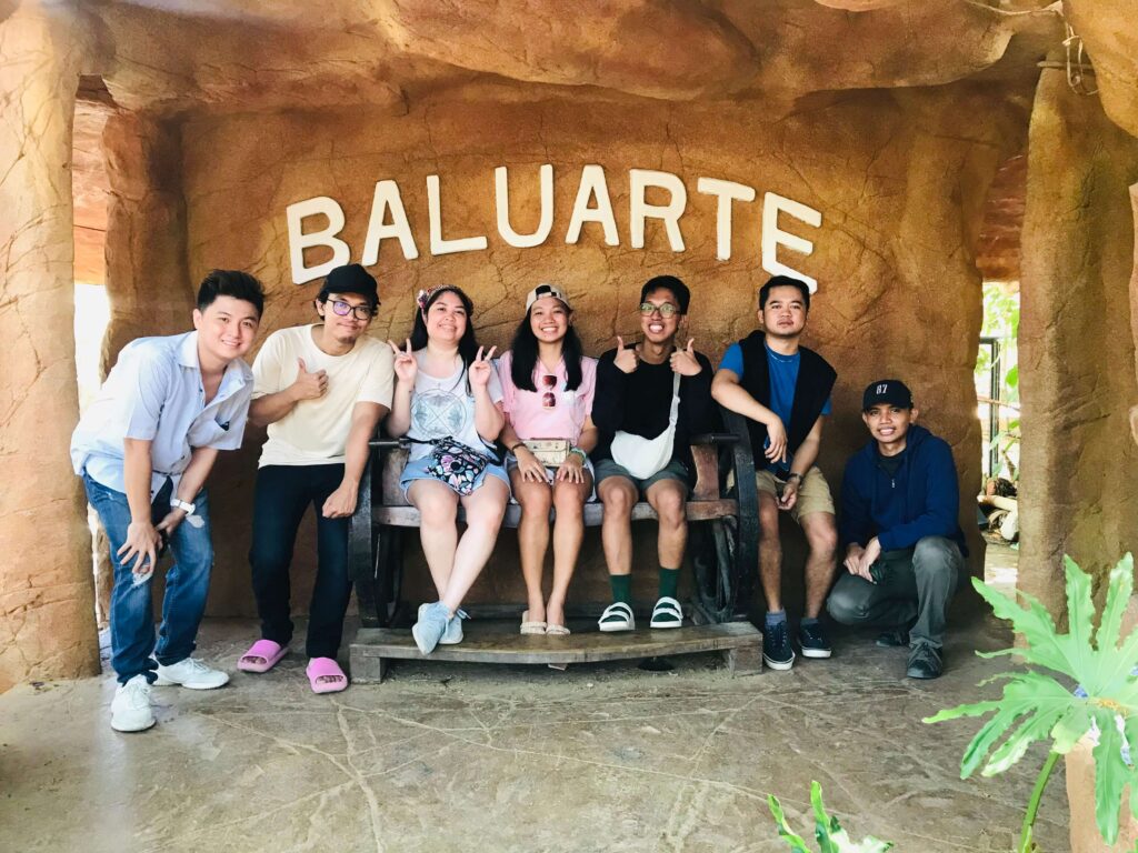 group picture with the signage of Baluarte